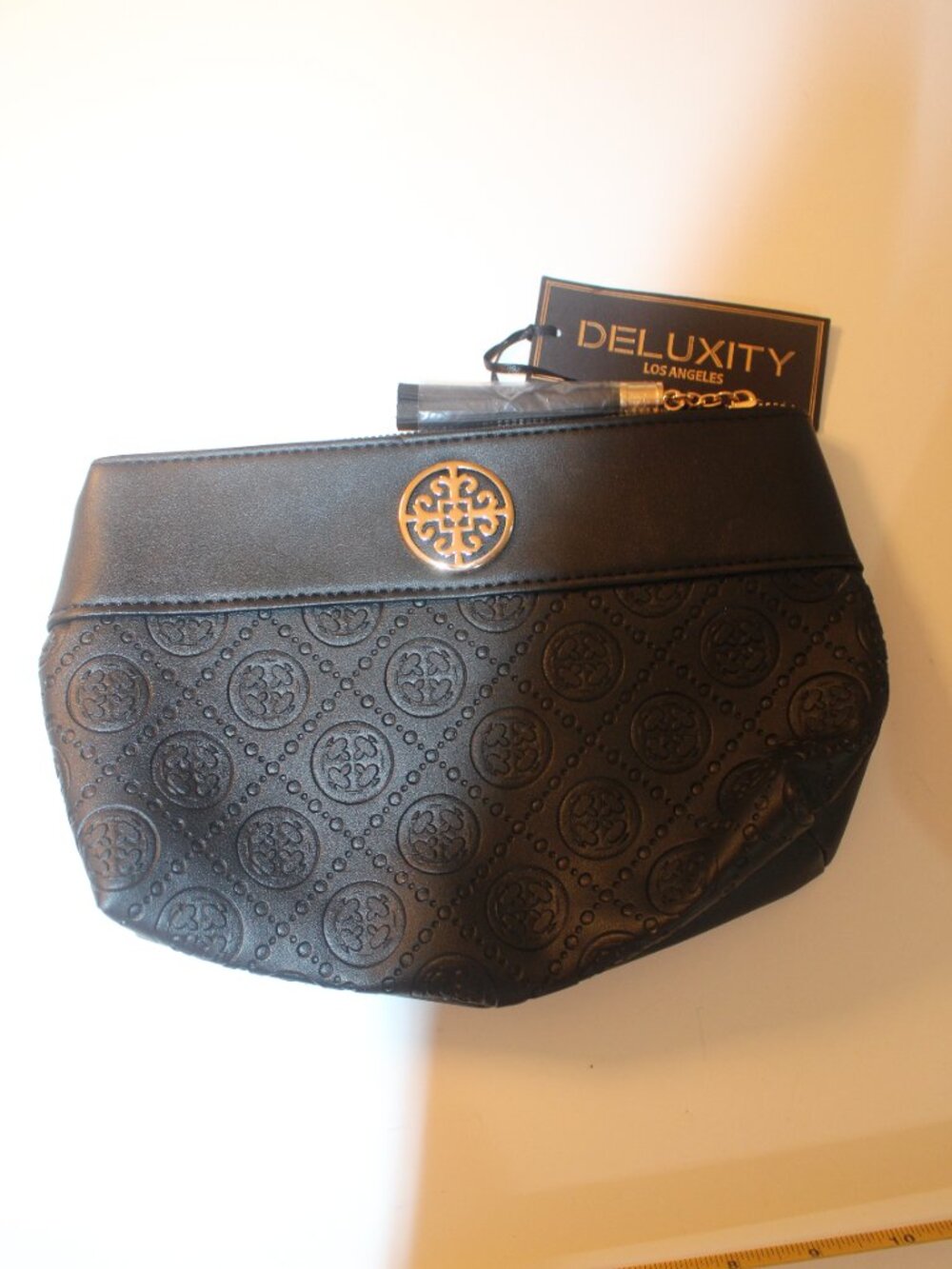Deluxity Los Angeles Black Embossed Medallion Zip Clutch With Tassel & Tags